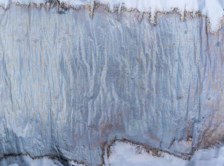 Crumpled and shiny silver paper background. high quality photoの写真素材