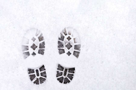 trail of shoes in the snow, tread in the snow.の写真素材