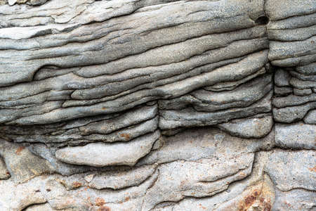 The rocks are colorful rock formations that have been deposited over hundreds of years. background and texture. high quality photoの写真素材