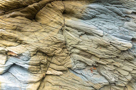 The rocks are colorful rock formations that have been deposited over hundreds of years. background and texture. high quality photoの写真素材