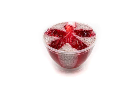 Pink jelly body scrub with strawberry scent on a white background. high quality photoの写真素材