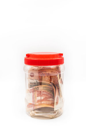 Glass jar with Russian money. Save or hide money in the bank. high quality photoの写真素材