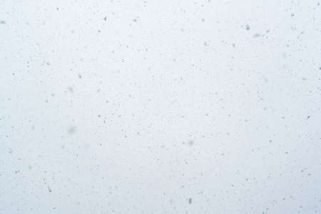 Snowfall texture snowflakes on blurred background weather design. high quality photoの写真素材