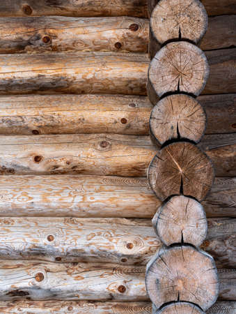 log house wall background. Construction of a wooden eco-friendly house from natural materials. Pattern and texture of wood masonry. high quality photoの写真素材