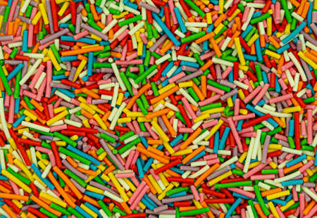 Dots of sugar sprinkles, cake and pastry decoration, lots of sprinkles as a background. high quality photoの写真素材