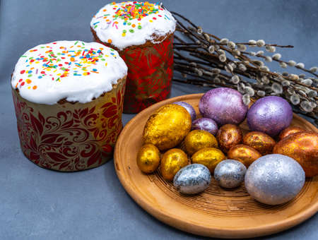 Happy Easter bread. Festive cake with traditional decor. Eggs, willow, trendy hard light, dark shadow.High quality photoの写真素材