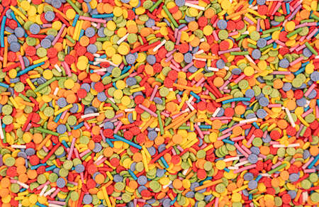 Dots of sugar sprinkles, cake and pastry decoration, lots of sprinkles as a background. high quality photoの写真素材