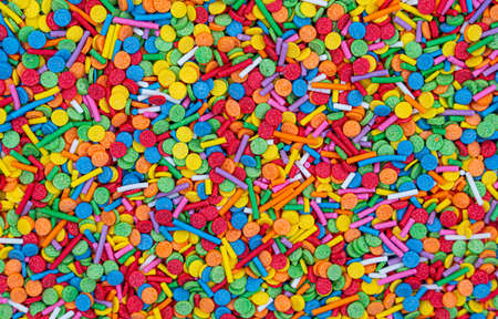 Dots of sugar sprinkles, cake and pastry decoration, lots of sprinkles as a background. high quality photoの写真素材