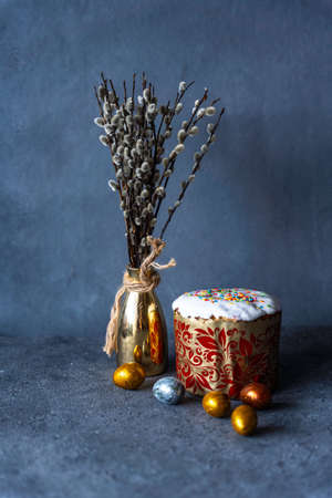 Happy Easter bread. Festive cake with traditional decor. Eggs, willow, trendy hard light, dark shadow.High quality photoの写真素材