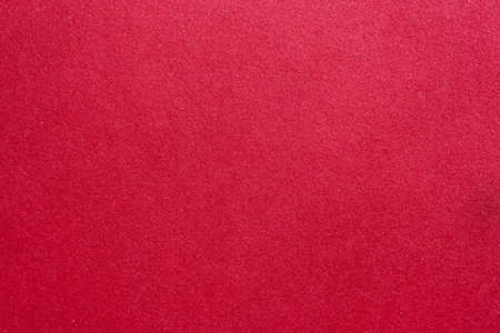 abstract red background or christmas paper with fine glitterの写真素材