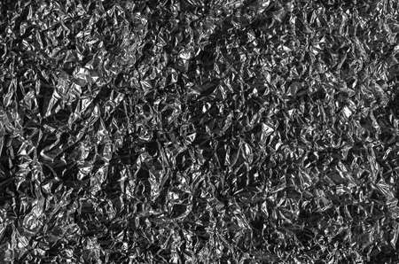 Abstract texture pattern metallic paper using as a background or wallpaper. Metal aluminum foil shiny and reflector. high quality photoの写真素材