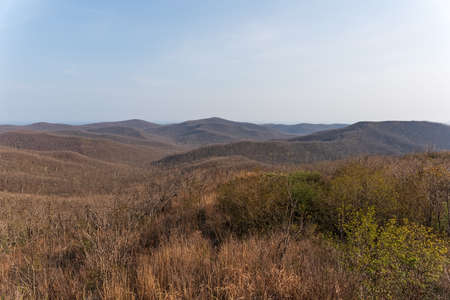 spacious green, yellow fields and mountains. high quality photoの写真素材