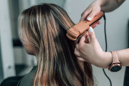 Hair iron straightening beauty care salon spa. high quality photoの写真素材