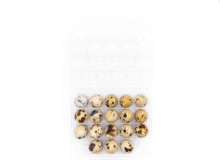 Uncooked scattered Quail eggs on white background top view, healthy food concept. high quality photoの写真素材