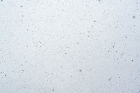 Snowfall texture snowflakes on blurred background weather designの写真素材