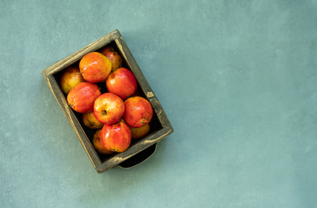 Ripe red apples in wooden box. Top view with space for your text. high quality photoの写真素材