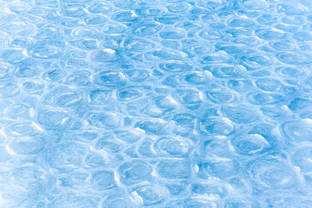 Colored ice. Abstract ice texture. Nature background. Sea ice. patterns on iceの写真素材