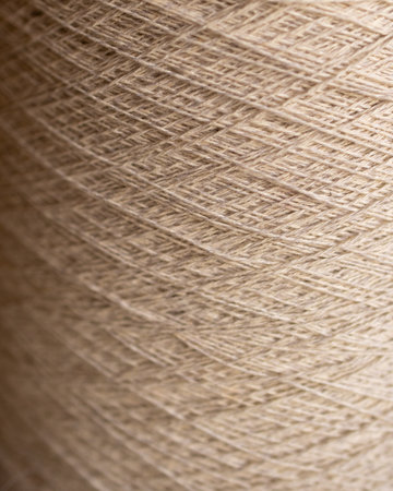 Wallpaper for textile products. Space for copy.Decorative background of rustic fibres in beige...
