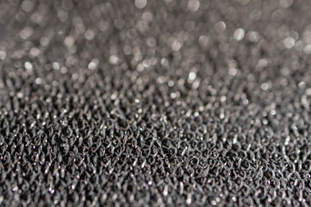 Steel grey textured fabric with partial blurring.Silver glitter background material. Used for backgrounds of fashion products. Space for text.の写真素材