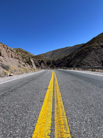 Tourism in Jujuy in a sunny winter day. Tourism in the north of Argentina. Winter holidays in Argentina. Background for tourism promotions and brochures. Concept of mountain tourismの写真素材