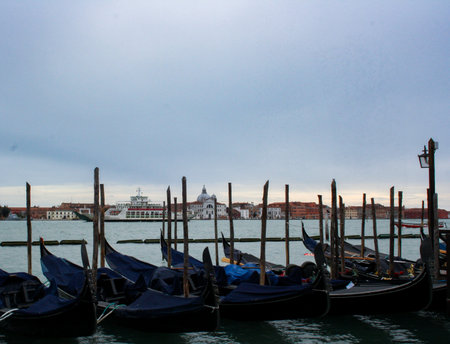 Gondolas in the foreground with the Basilica of San Giorgio in the background, Venice.Wallpaper, background for tourism advertisements and brochures.Copy space .Real pictureの写真素材