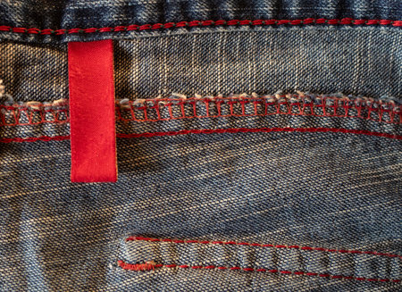 Macro denim clothing lael with empty copy space for graphic design. Clothing care concept. Blank label for branding and care messages.の写真素材