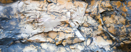 Texture of the mountain surface. Close up.Horizontal wallpaper of stone with texture in rust tones. Horizontal graphic resource for backgrounds with selective blur.High quality. Copy space.の写真素材