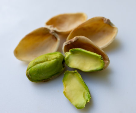 Macro photography of pistachios with special attention to texture and freshness. Ideal for vegan and healthy eating images. Ideal for vegan and clean eating visuals.の写真素材