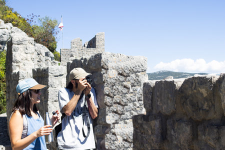 Tourist couple touring the walls of Ston, Croatia .Affordable luxury getawaysの写真素材