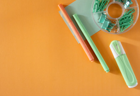 Top-down view of cool school materials, such as pencils and markeres arranged on a vibrant background. Perfect for educational, e-learning or academic themed visual materials. No people, modern aesthetic. copy spaceの写真素材