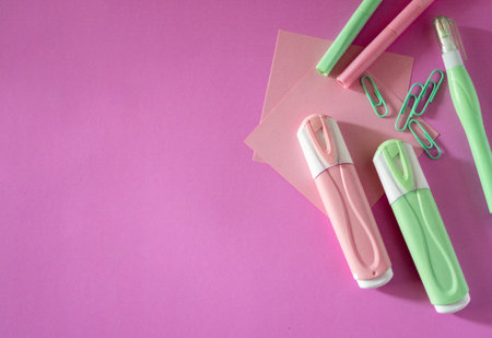 Stylish school supplies design for the new school year on pink background. Perfect for educational, e-learning or academic themed visual materials. No people.の写真素材