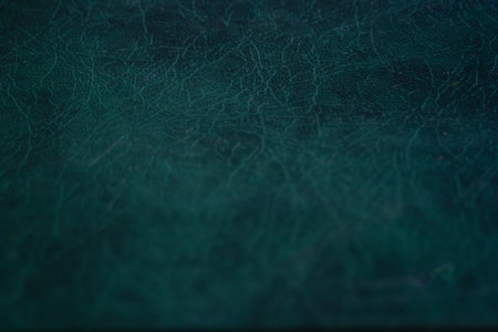 Close-up of teal leather surface, elegant and modern texture, perfect for fashion accessories, luxury branding, and interior design mockups.の写真素材