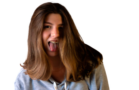 Teenager wearing casual clothes, cropped for designs related to youth culture,white backdrop. Z...