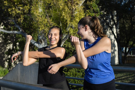 Horizontal shot of teenage friends training outdoors, healthy lifestyle and youth activity Perfect...