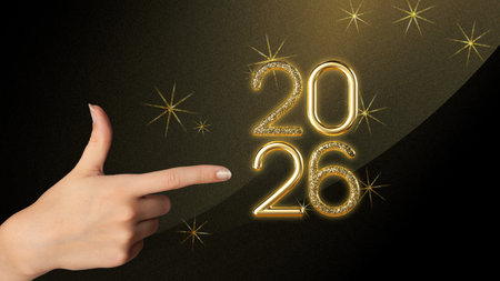 Festive golden 2026 numbers with sparkling decoration and female hand, great for ads, posters, and...