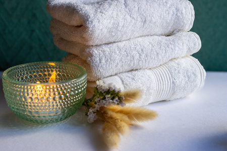 A modern and delicate composition featuring beauty products with sunlight and delicate spa decor,...