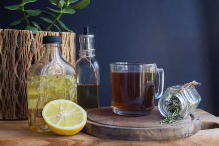 Natural remedies and alternative medicine for health and relaxation, and a cup of hot lemon tea in the background. Copy space. Horizontal real pictureの写真素材