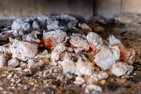 Glowing embers radiate intense heat. They are the perfect base for barbecuing, grilling or providing heat in an outdoor fireplace or brazier.の写真素材