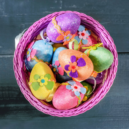 easter eggs in violett basket on wooden background. Top view.