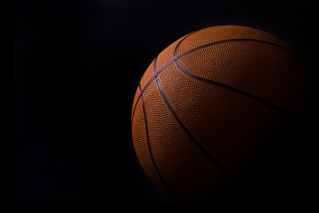 baskettball detail isolated in blackの写真素材