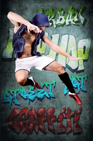 young man jumping with grunge backgroundの写真素材