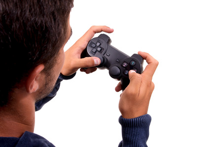 teenage boy holding console controller