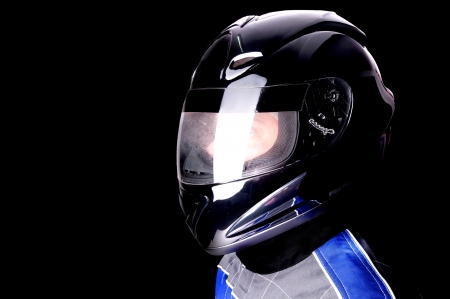 race driver isolated in dark backgroundの写真素材