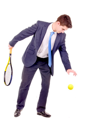 young businessman playing tennis isolated in whiteの写真素材
