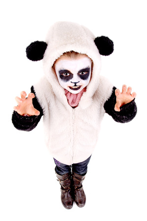 little girl painted as a panda bear isolated in whiteの写真素材