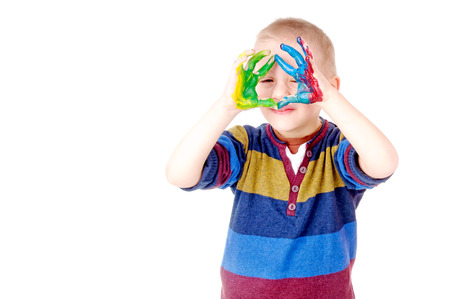 little boys with painted hands isolated in white