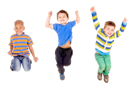 little boy jumping isolated in white