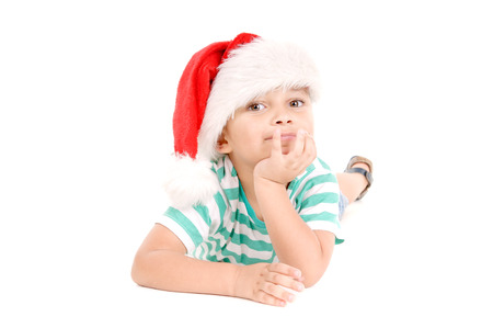 little boy with christmas hat isolated in white backgroundの写真素材