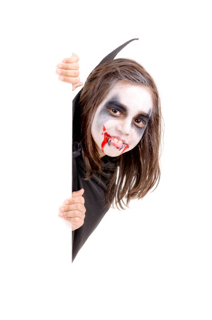 little girl dressed as a vampire on halloween isolatedの写真素材