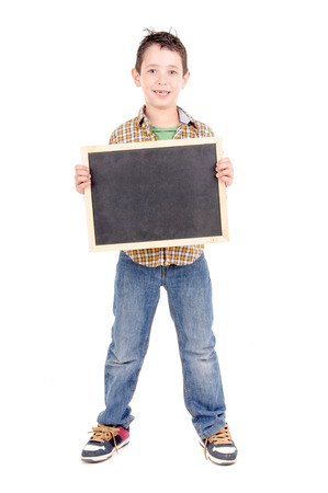little boy holding blackboard isolated in white backgroundの写真素材